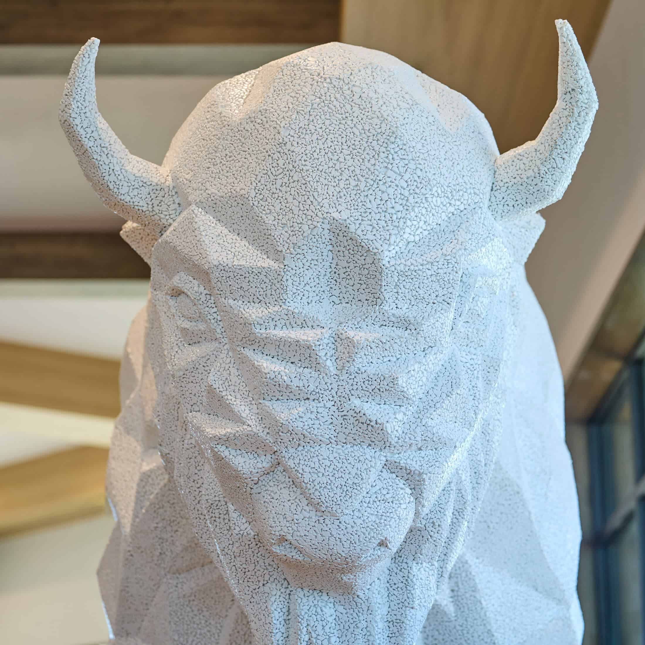 a white, textured bison statue at Choctaw Landing hotel.