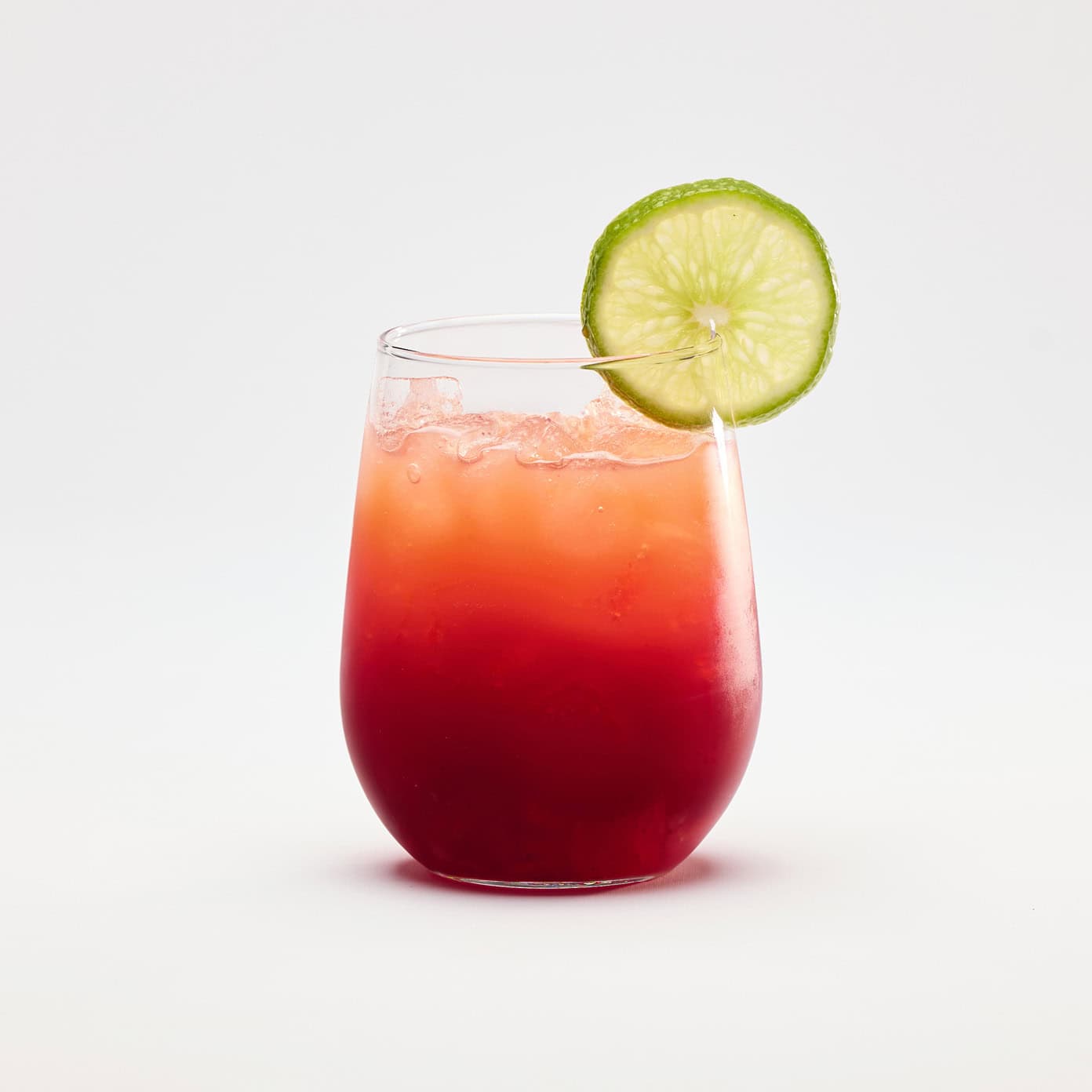 A vibrant cocktail featuring Crown Royal, blackberry puree, orange juice, and grenadine.