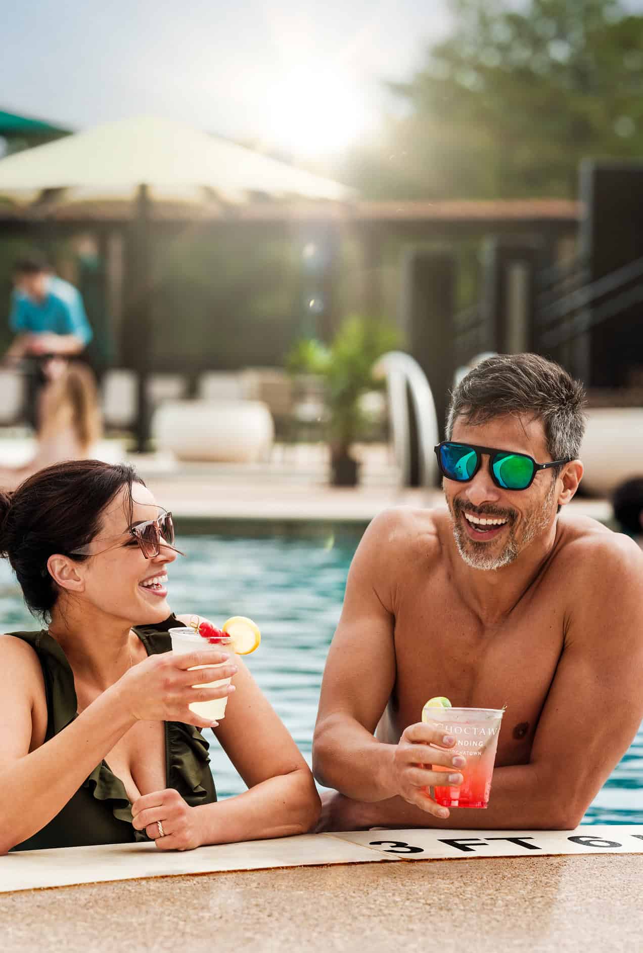 Oka Sita Pool Party, two adults enjoy the pool