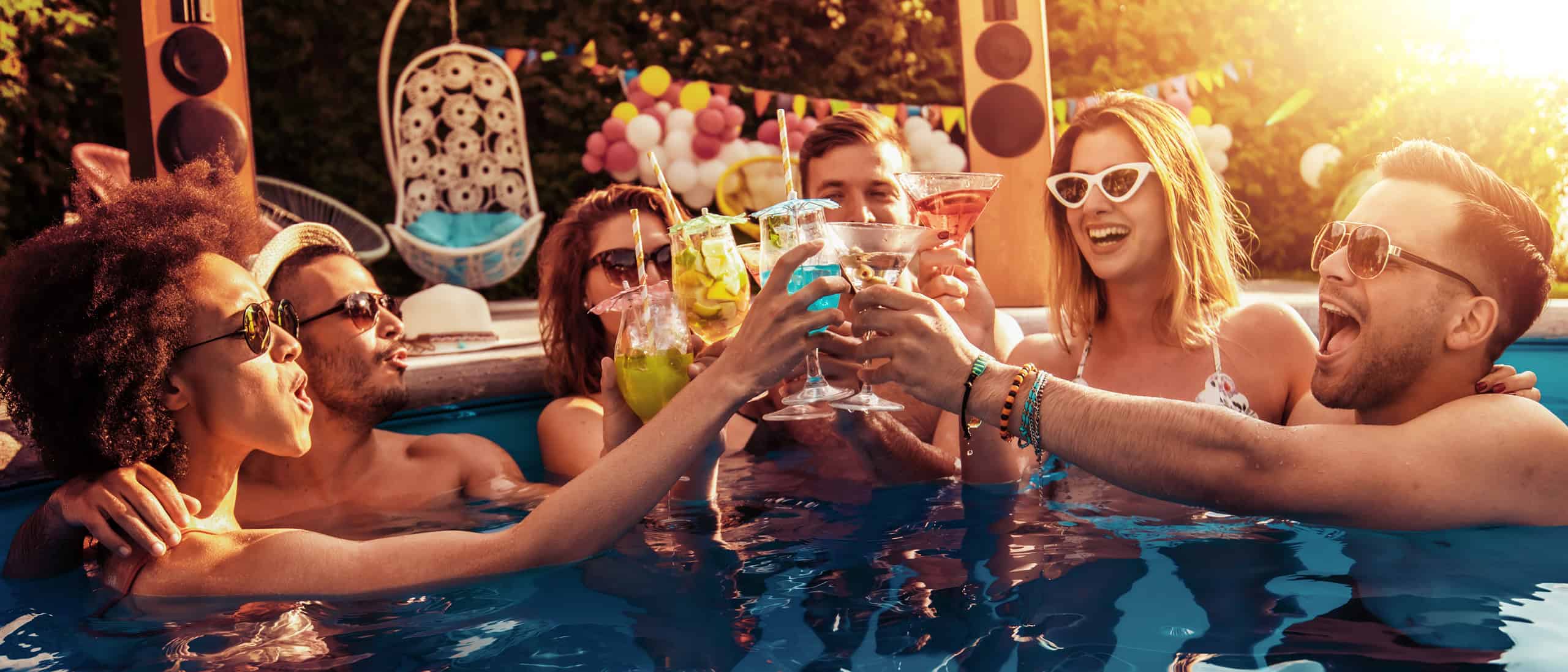 Group of people in Oka Sita pool celebrating Memorial Day weekend.